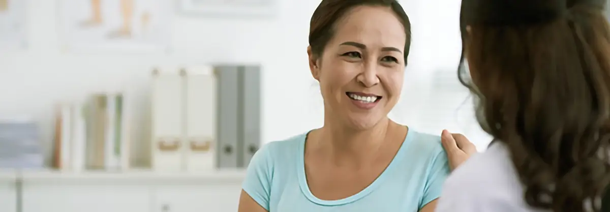 photo of a woman in a GP consultation